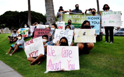 MEO Youth Services-leaders join homeless awareness sign waving