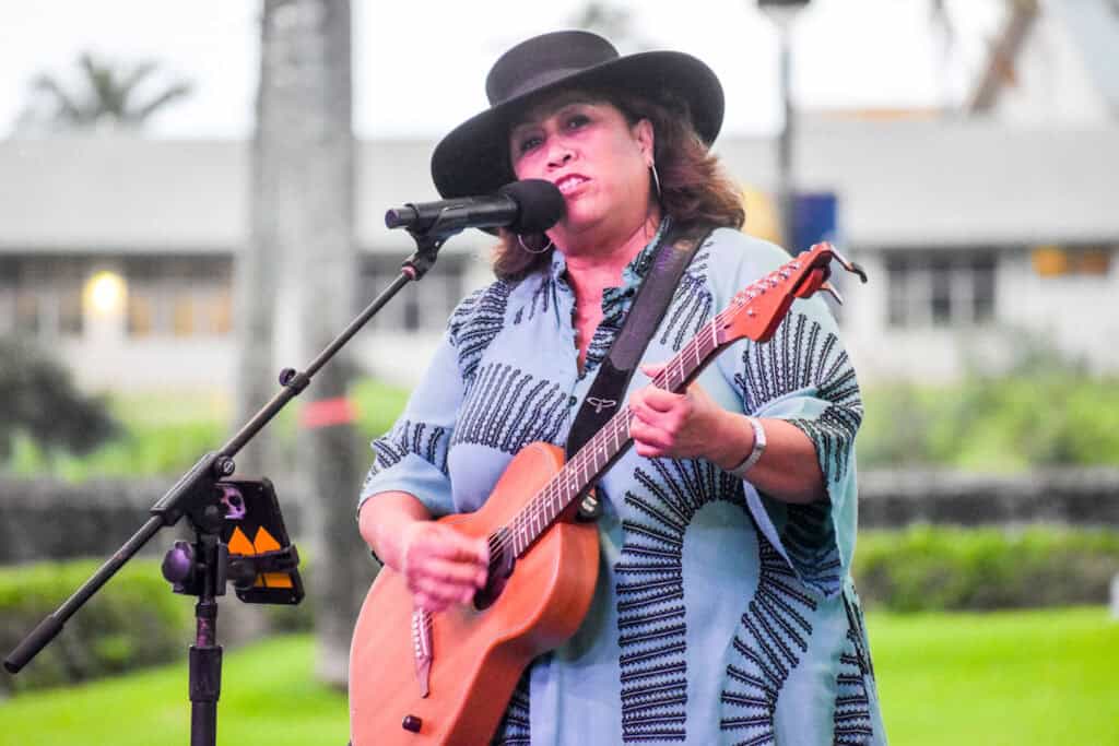 Kopa`a Tita Liz Morales playing her guitar.
